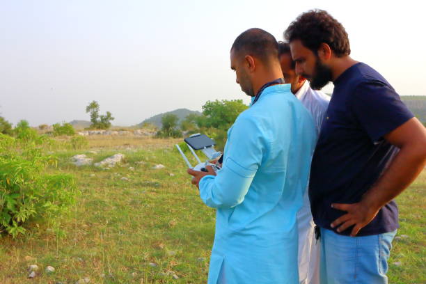 A drone operator photographing and controlling the drone during flight near Kalar Kahar, Punjab, Pakistan.
Location: Kalar Kahar, Punjab, Pakistan.
Date Taken: August 31, 2018.